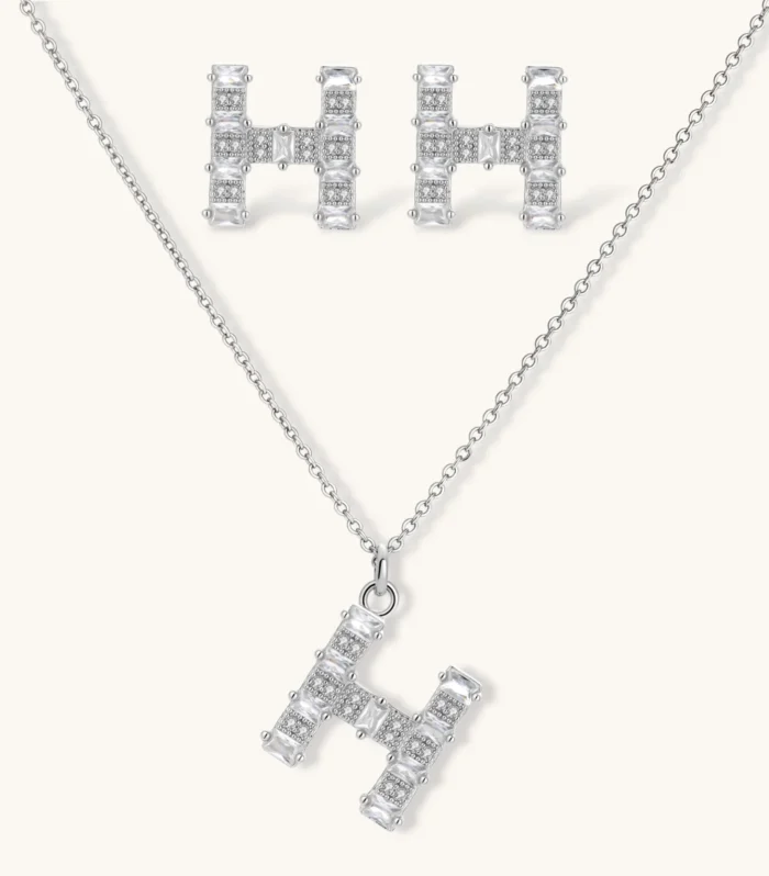 Letter H jewelry set featuring geometric crystal design in gold and white gold plated finish with adjustable chain necklace