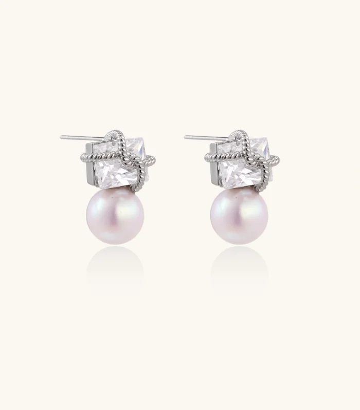 White gold stud earrings with square crystal stones in twisted frames and pink freshwater pearl drops below