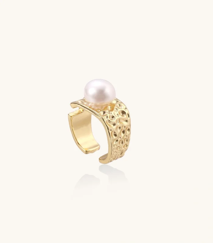 Wide gold-plated ring with organic textured band and white freshwater pearl centerpiece